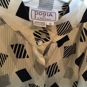 Lovely ladies Black & \White 100% Silk Blouse, SIZE 8, with one-button Epilets